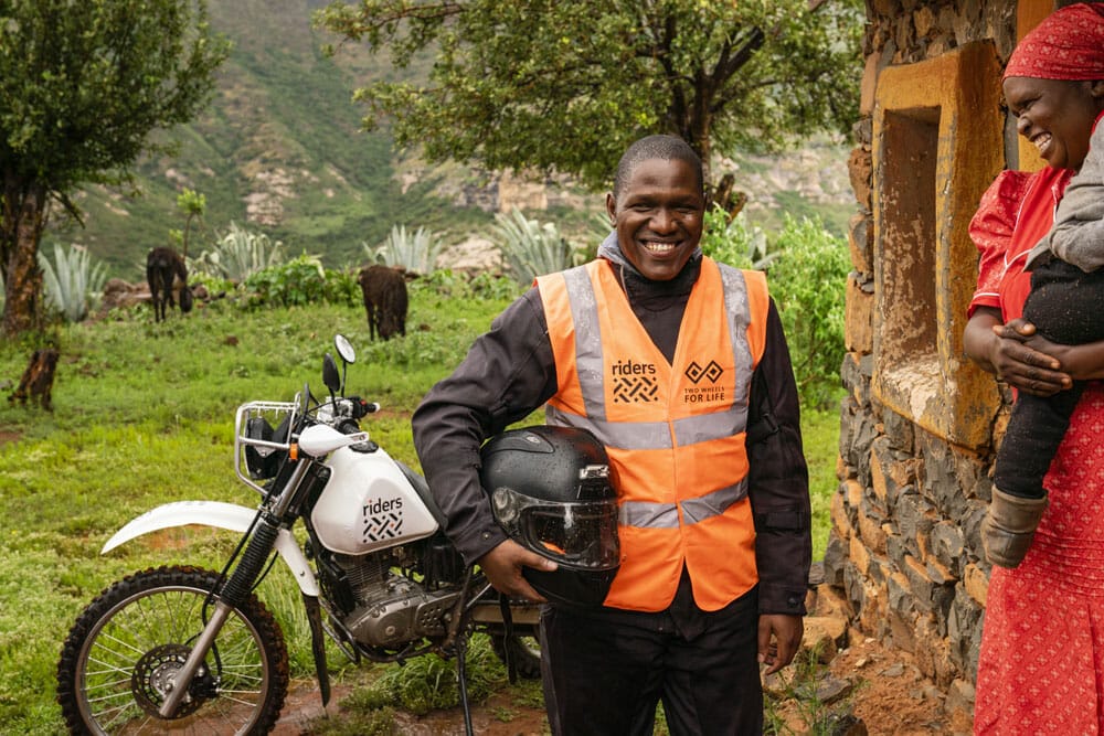 Riders for Health Lesotho, school, healthworker, child, mother, motorcycle