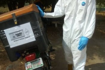 Sample courier in PPE, Nigeria